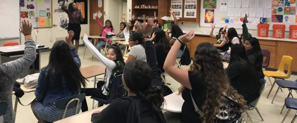 Participants with hands raised